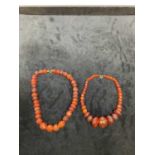 Two graduated Baltic amber bead necklaces, combined approx 73g (2).