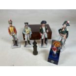Four porcelain figures of military soldiers, a David Beckham figure, a mahogany box, and a small