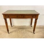 A late Victorian mahogany two drawer side table with leather inset top, width 106cm.