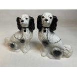 A pair of reproduction Staffordshire style black and white spaniels, height 31cm.