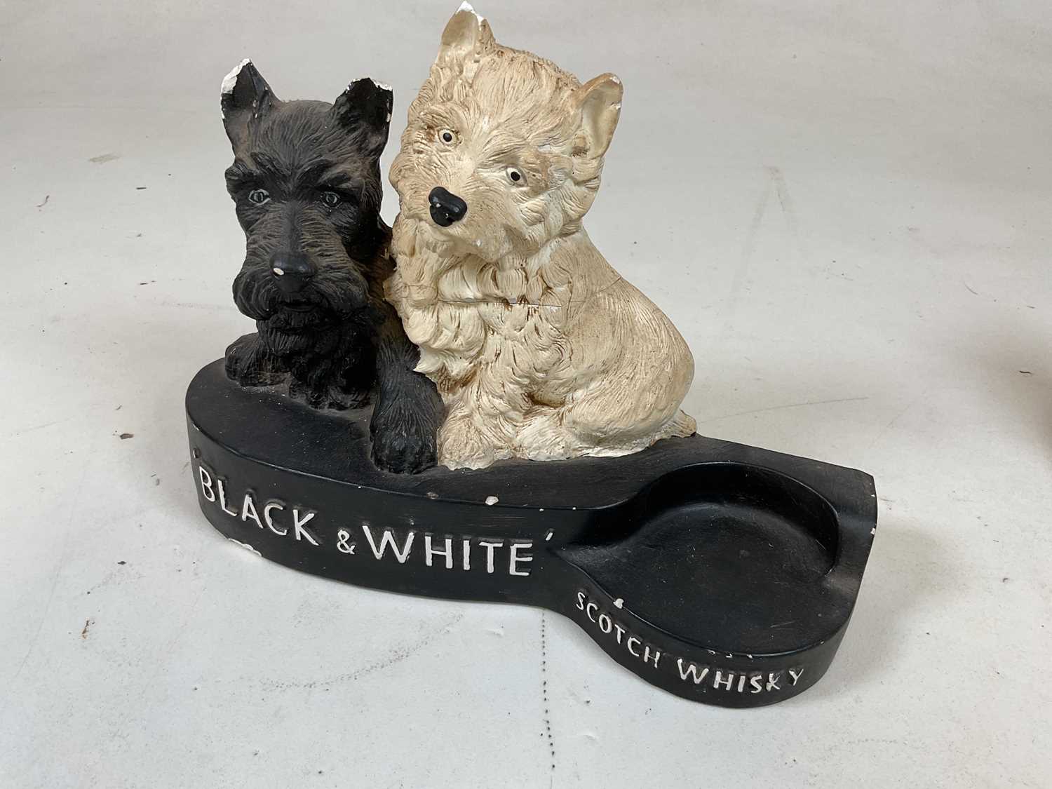 A painted plaster advertising Black & White Scotch Whisky bottle holder, width 31cm, and a near - Image 2 of 5