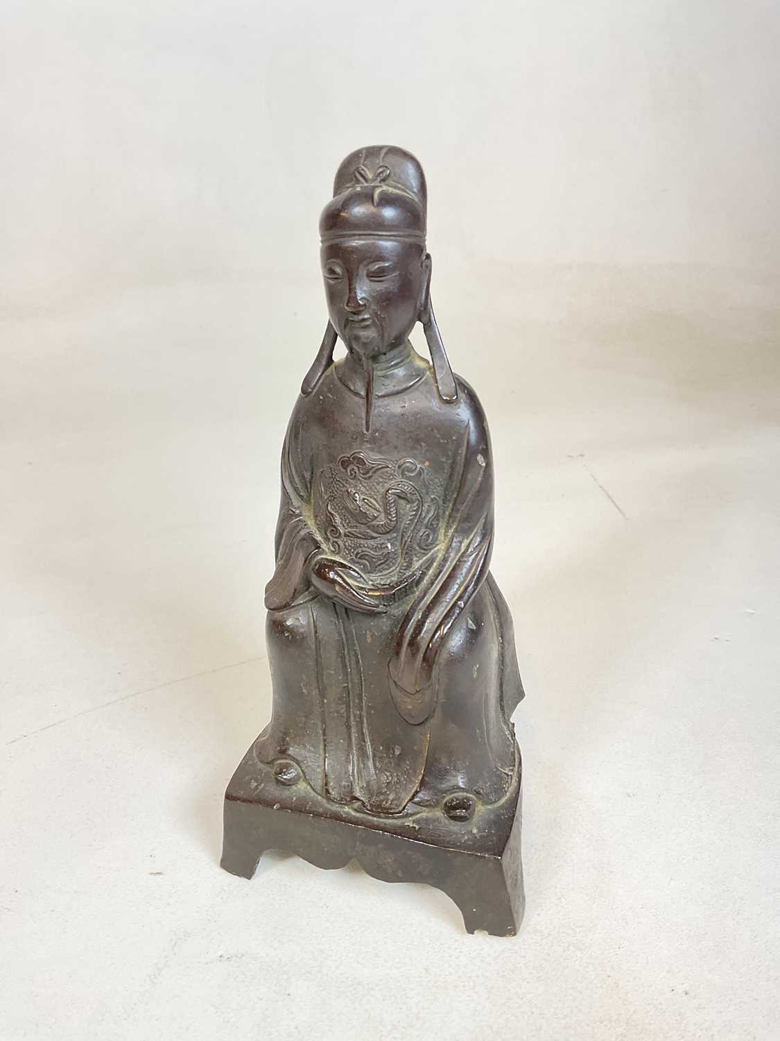 A rare 16th/17th century Chinese Ming Dynasty bronze figure of a seated court official, height 25.