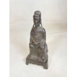 A rare 16th/17th century Chinese Ming Dynasty bronze figure of a seated court official, height 25.