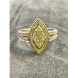 A 9ct white gold and diamond lozenge shaped ring, the diamonds on a CGL report detailing colour