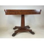 An early Victorian mahogany card table raised on octagonal tapering central column to