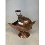 A Victorian copper coal scuttle with fixed carrying handles, length 48cm.