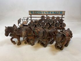 A group of breweriana, including a Lowenbrau cart.