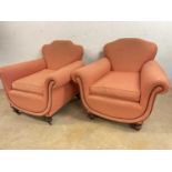 A pair of Art Deco inspired upholstered easy chairs, raised on turned squat front legs.