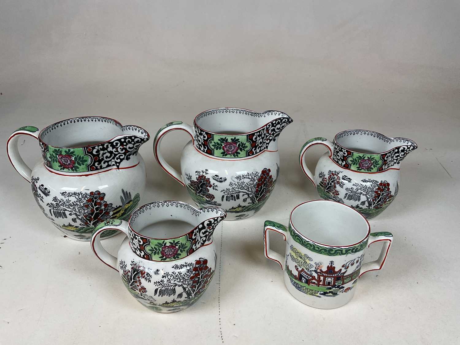 T.G. GREEN & CO LTD; four 'Ming' decorated jugs and a similarly decorated twin handled cup (5). - Image 3 of 14