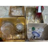 A large quantity of decorative glassware including decanters bowls vases etc.