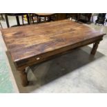 A large rustic hardwood low coffee table, 136 x 92 x 41cm.