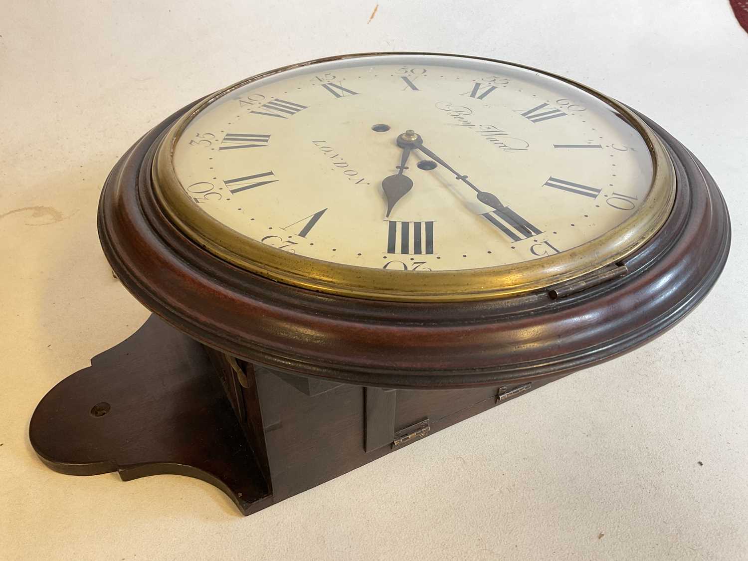 A rare 19th century mahogany cased circular wall clock, the repainted dial set with Roman numerals - Image 7 of 12