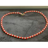 A coral and cultured pearl bead necklace with 9ct gold clasp, length 40cm.