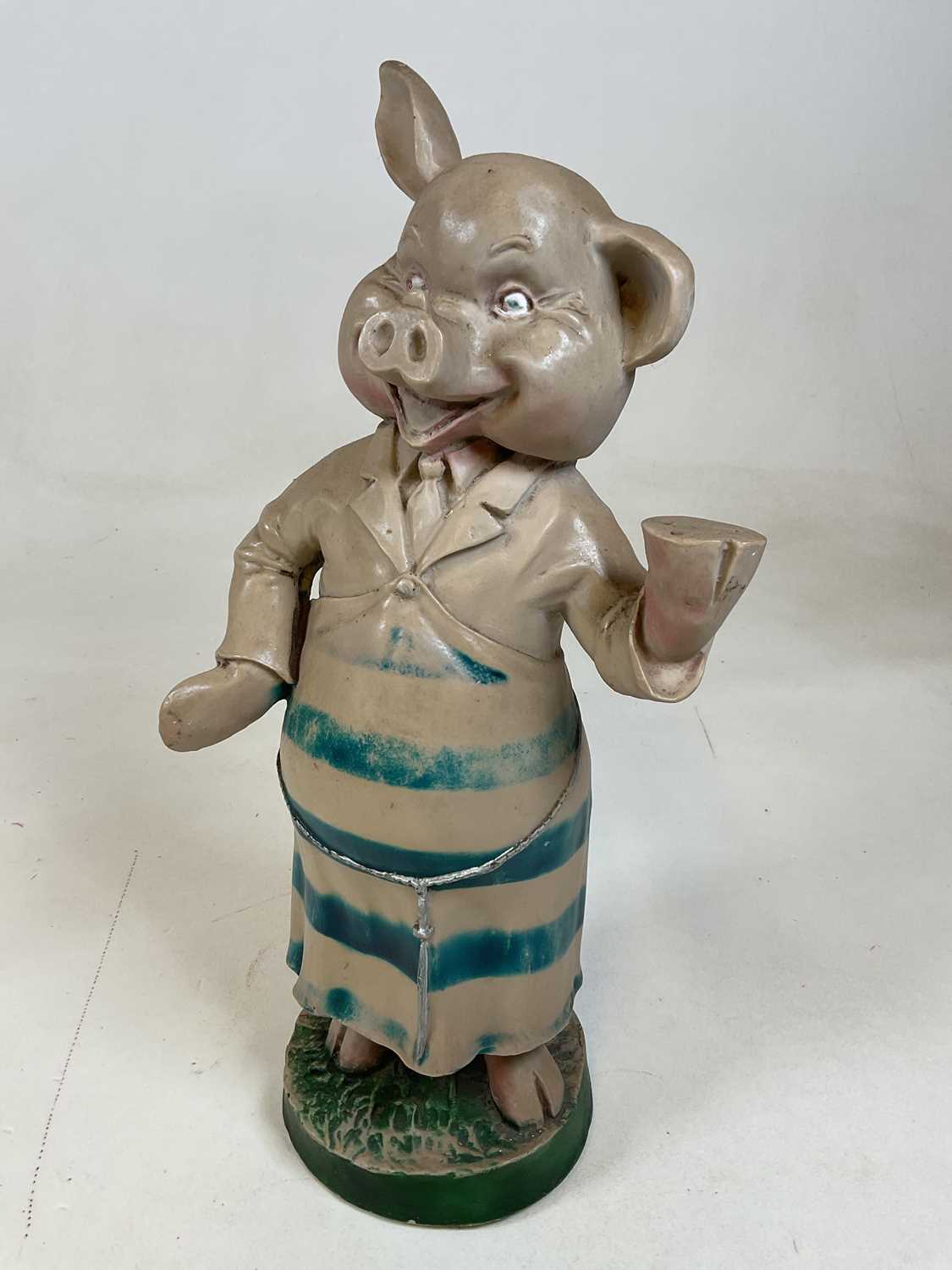 A vintage resin butcher's advertising pig, height 47cm.