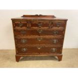 A mahogany simulated inlaid and featherbanded chest of three short and three long graduated