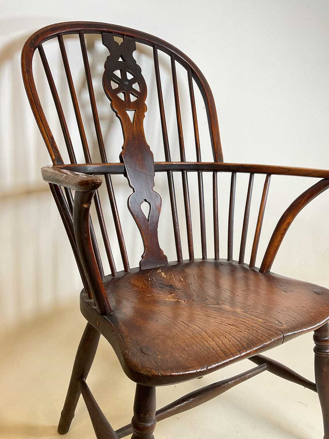 An early to mid-19th century ash and elm hoop back Windsor elbow chair with saddle seat and straight - Image 4 of 7