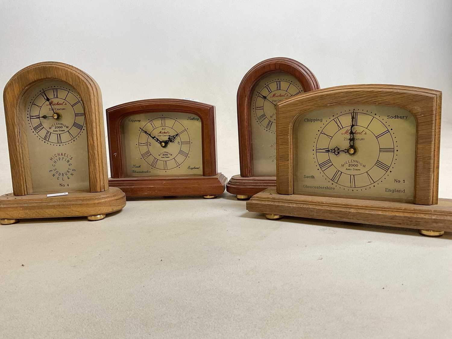 Four small battery operated Michaels 21st Centuty Millenium 2000 clocks. Hand built at the Old