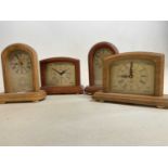 Four small battery operated Michaels 21st Centuty Millenium 2000 clocks. Hand built at the Old