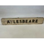 A vintage white painted and applied village sign, 'Aylesbeare', width 81.5cm.