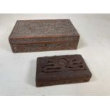A mid-20th century Indian carved rectangular lidded box decorated with dragons and inscribed to