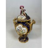 A large mid-19th century English porcelain vase and cover, the domed pierced cover set with a