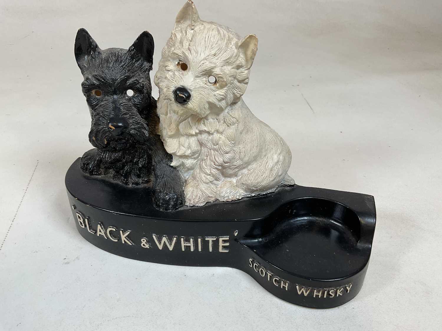 A painted plaster advertising Black & White Scotch Whisky bottle holder, width 31cm, and a near - Image 4 of 5