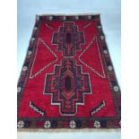 A Baluchi rug, 133 x 85cm.