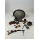 An Eastern white metal jug, a corkscrew, a silver plated oval tray, etc.
