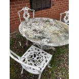 A Victorian style circular garden table, diameter 106cm, height 71cm, and three chairs (4).