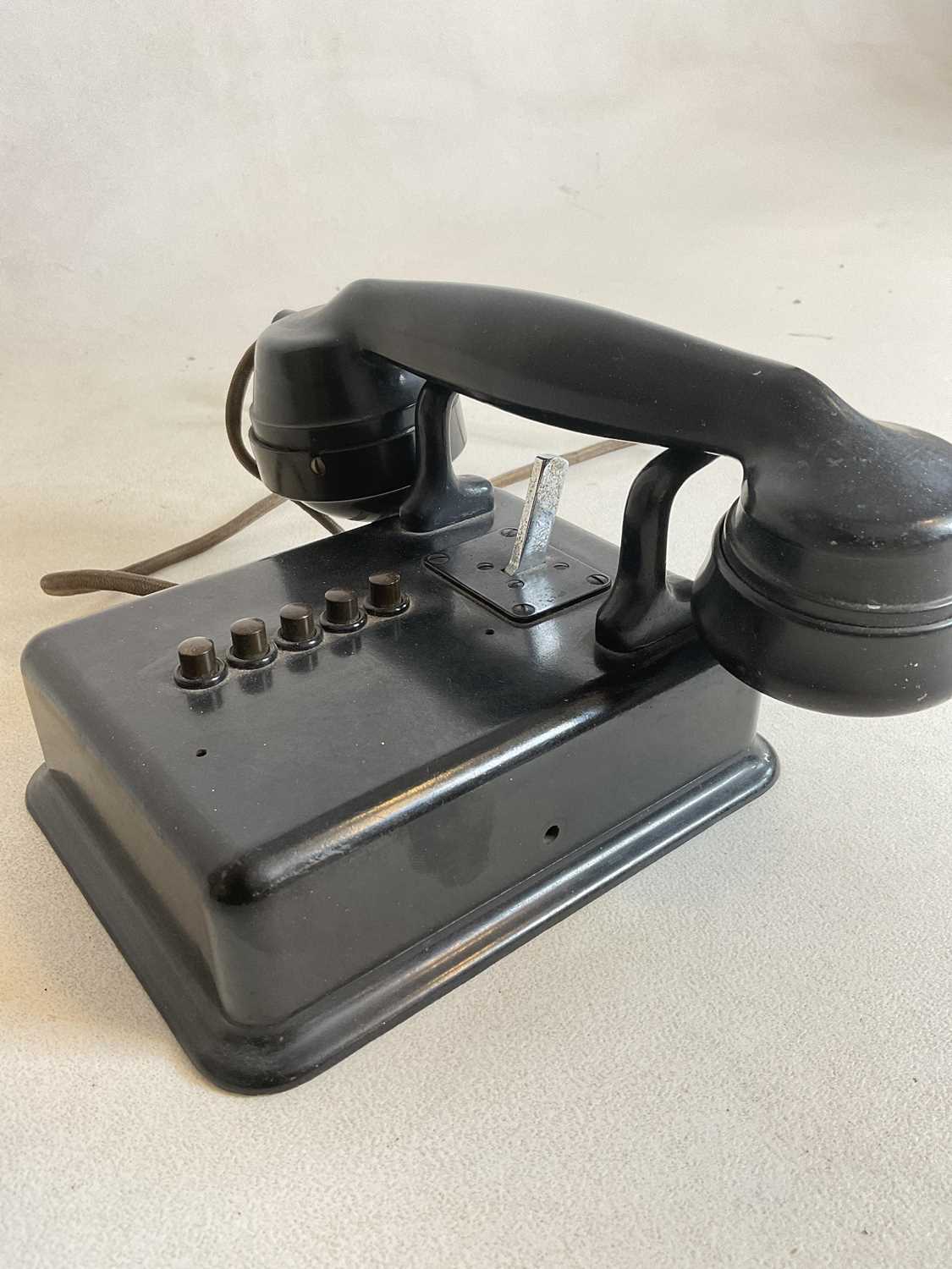 A vintage black bodied wall mounted telephone with five buttons and no dial. - Image 2 of 5