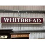 A large advertising sign. 'Whitbread', on plyboard backing (loss to lower right corner) 255cm W x