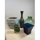 A green tinted glass carboy, a modern Chinese jardiniere, metal vase, Dog of Fo, and glass vase (