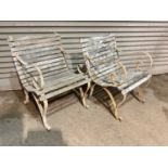 A pair of wrought iron and wooden slatted garden chairs, each width approx 60cm.