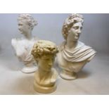A pair of decorative painted plaster busts depicting Classical figures on socle bases, height