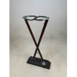 A vintage shooting stick now on an associated wooden plinth mounted as a display item, height 71cm.