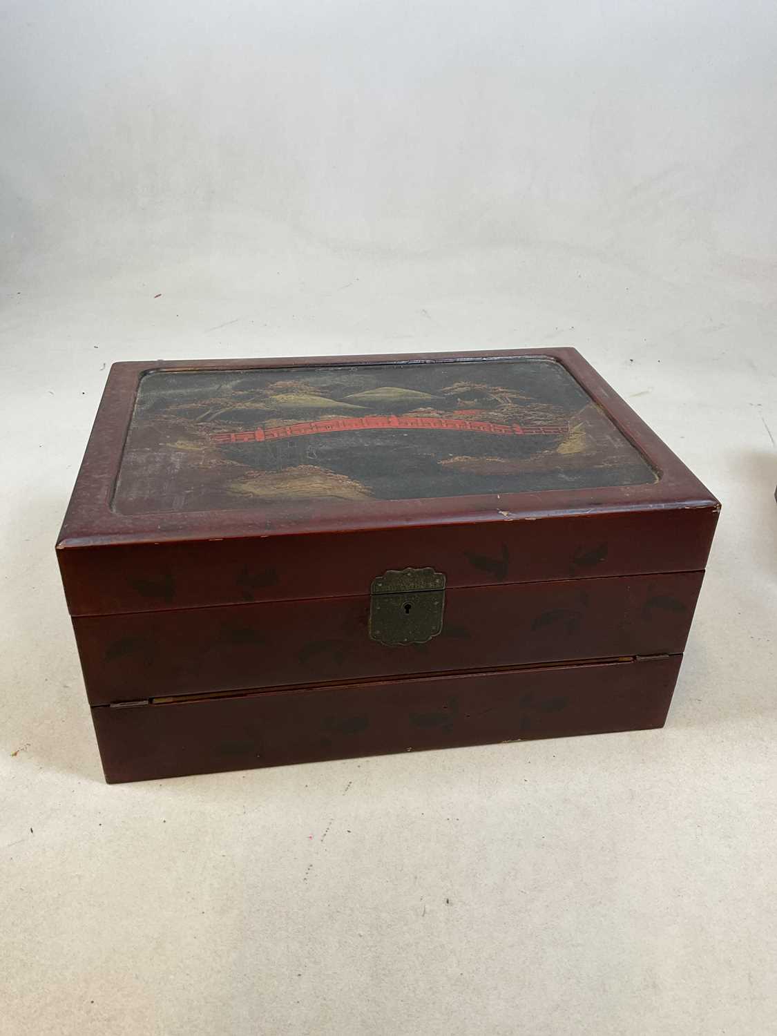 An early 20th century Japanese red lacquered and painted writing slope with hinged interior and - Image 2 of 10