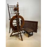A late 19th century correction chair with Bergere caned seat, a vintage spinning wheel, a twin