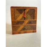 An early 20th century Japanese straw work decorated table top cabinet, width 21cm.Condition
