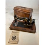 A walnut cased sewing machine,