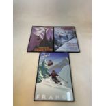 Three reproduction ski posters, framed and glazed.