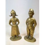 A large pair of brass flat backed figures depicting Dutch boy and girl, height 48cm.