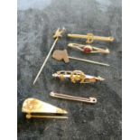 Four 9ct yellow gold bar brooches (approx. 6g) and three stick pins.