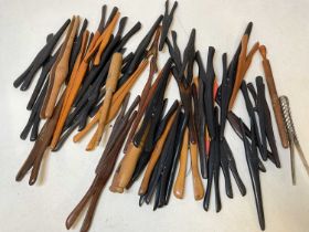 A large collection of glove stretchers.
