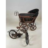 A doll's pram and a rustic scratch built miniature model of a bicycle (2).