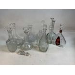 A quantity of decorative glassware including decanters.