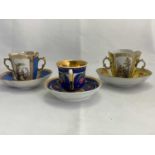 A pair of late 19th century Continental twin handled cups and saucers of quatrelobed form, with