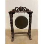 A Victorian carved oak gong, height 100cm.