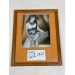 PAULA ABDUL; a colour photograph of the star above her signature further inscribed 'XOXO!' 35 x 27cm