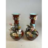 A large and impressive pair of late 19th century French majolica figural vases, height 53.5cm.