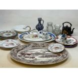 A large group of decorative ceramics including an oval meat platter, decorative plates, stoneware